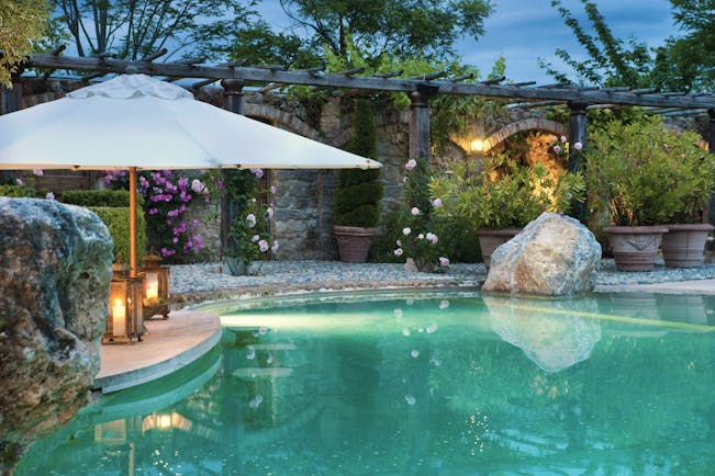 Borgo Santo Pietro Tuscany pool  terrace flowers umbrella