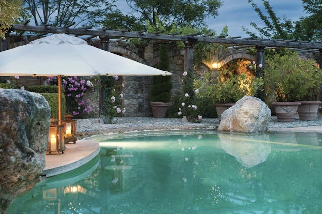 Borgo Santo Pietro Tuscany pool  terrace flowers umbrella