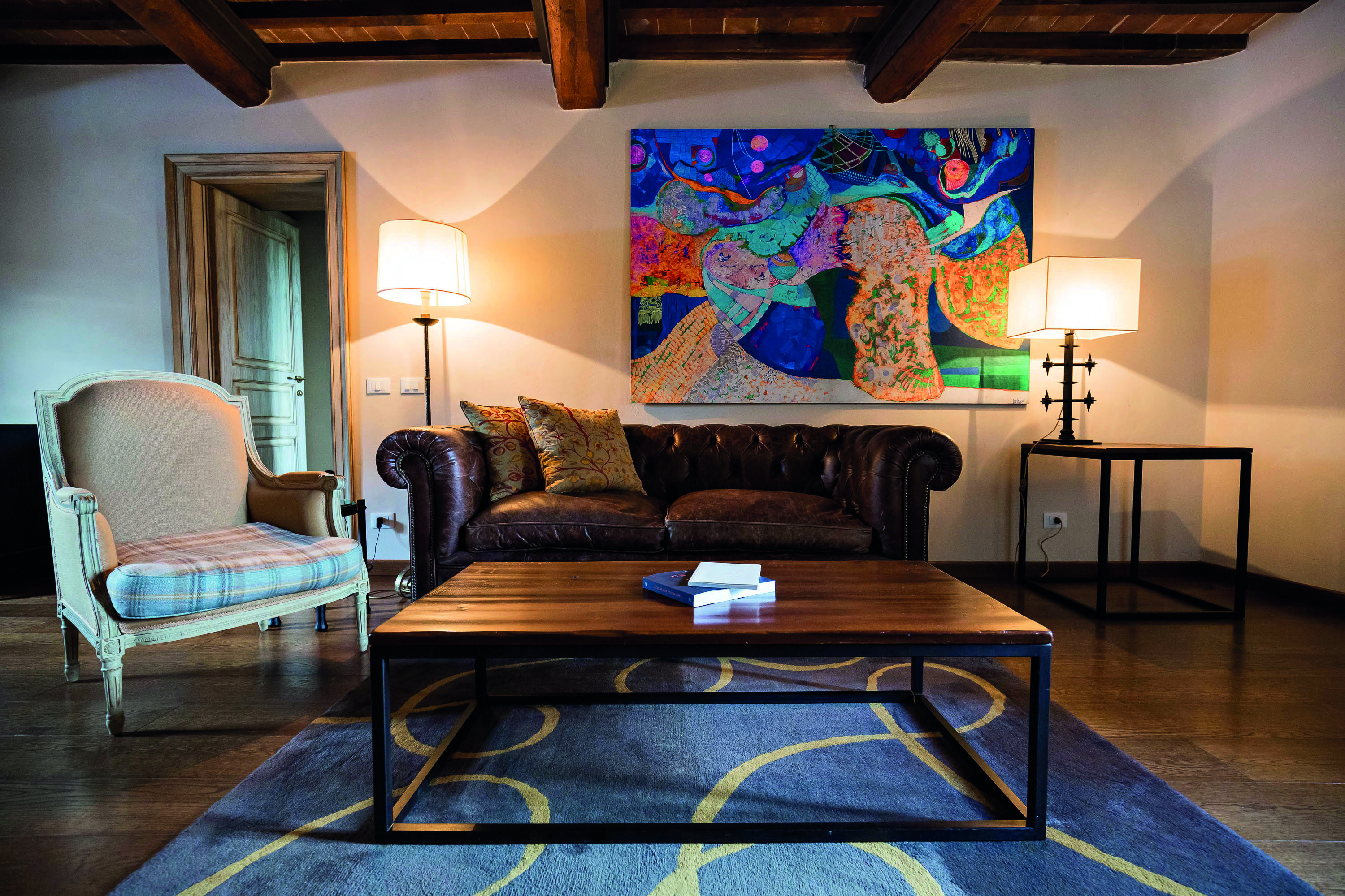 Castel Monastero Tuscany lounge area sofas modern artwork