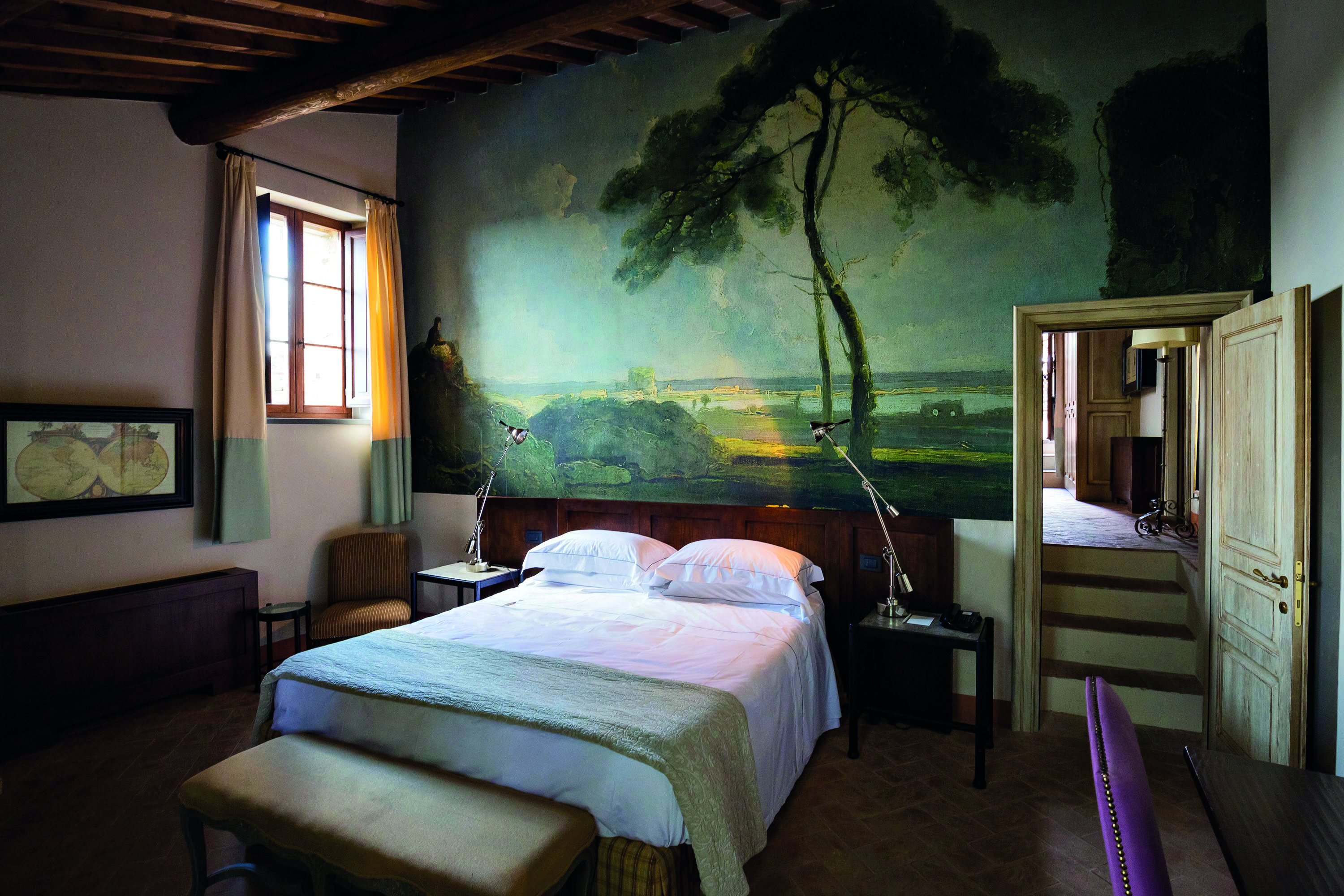 Castel Monastero Tuscany villa bedroom traditional décor nature mural