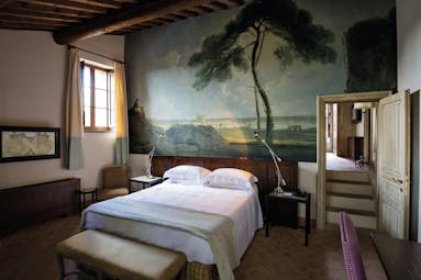 Castel Monastero Tuscany villa bedroom traditional décor nature mural