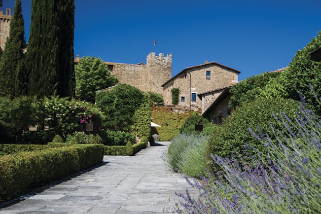 Castello Banfi Tuscany exterior path way lined with shrubs and flowers