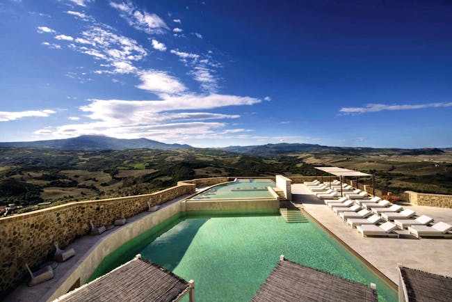 Castello di Velona Tuscany pool view sun loungers pool terrace views of countryside