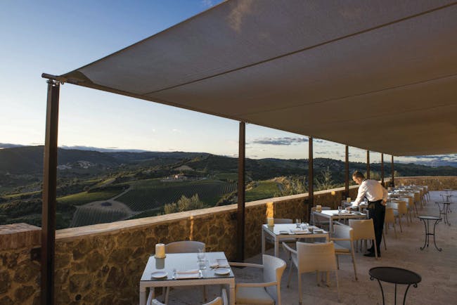 Castello di Velona Tuscany restaurant terrace outdoor dining overlooking countryside