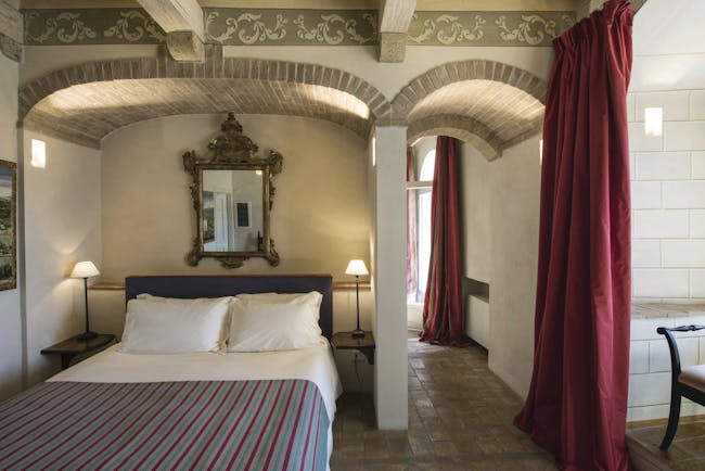 Castello di Velona Tuscany terrace suite ornate décor bed original ceiling