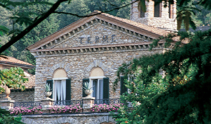 Grotta Giusti Tuscany entrance exterior hotel building balcony flowers