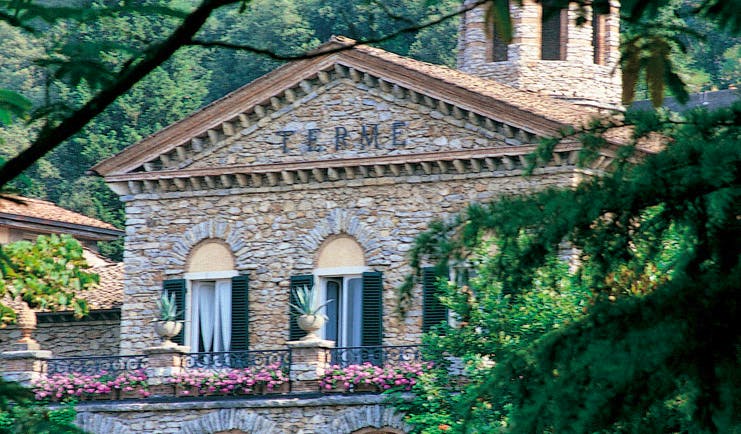 Grotta Giusti Tuscany entrance exterior hotel building balcony flowers