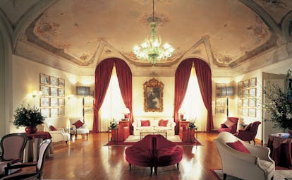 Grotta Giusti Tuscany giusti hall indoor lounge area sofas chairs ornate décor