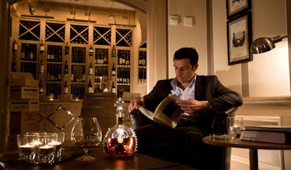 Grotta Giusti Tuscany wine cellar wine man reading book about wine