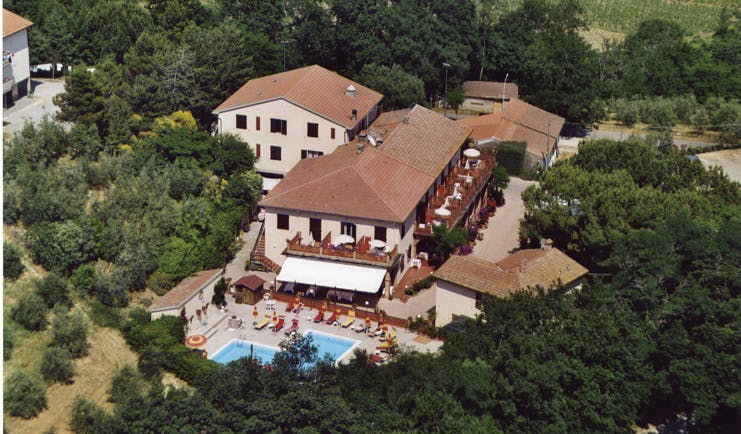 Hotel Le Renaie Tuscany aerial shot of hotel buildings pool surrounding countryside