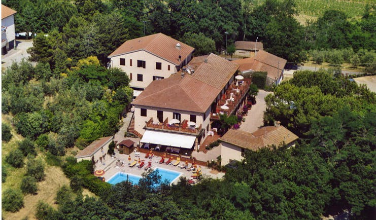 Hotel Le Renaie Tuscany aerial shot of hotel buildings pool surrounding countryside