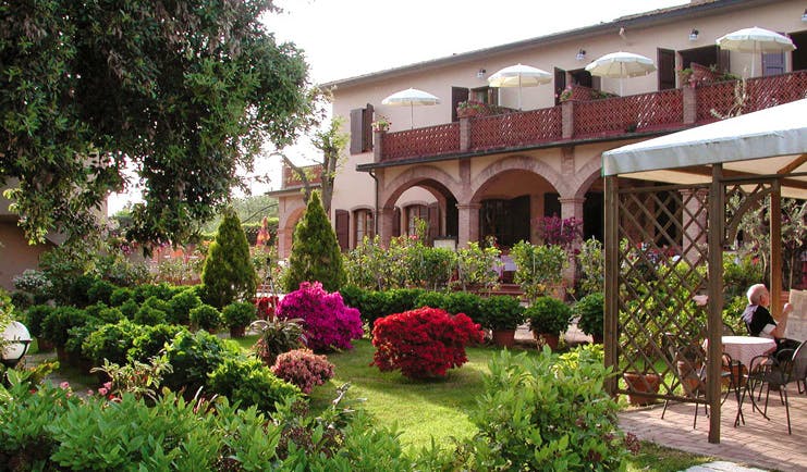 Hotel Le Renaie Tuscany hotel grounds gardens hotel building patio lawns trees flowers