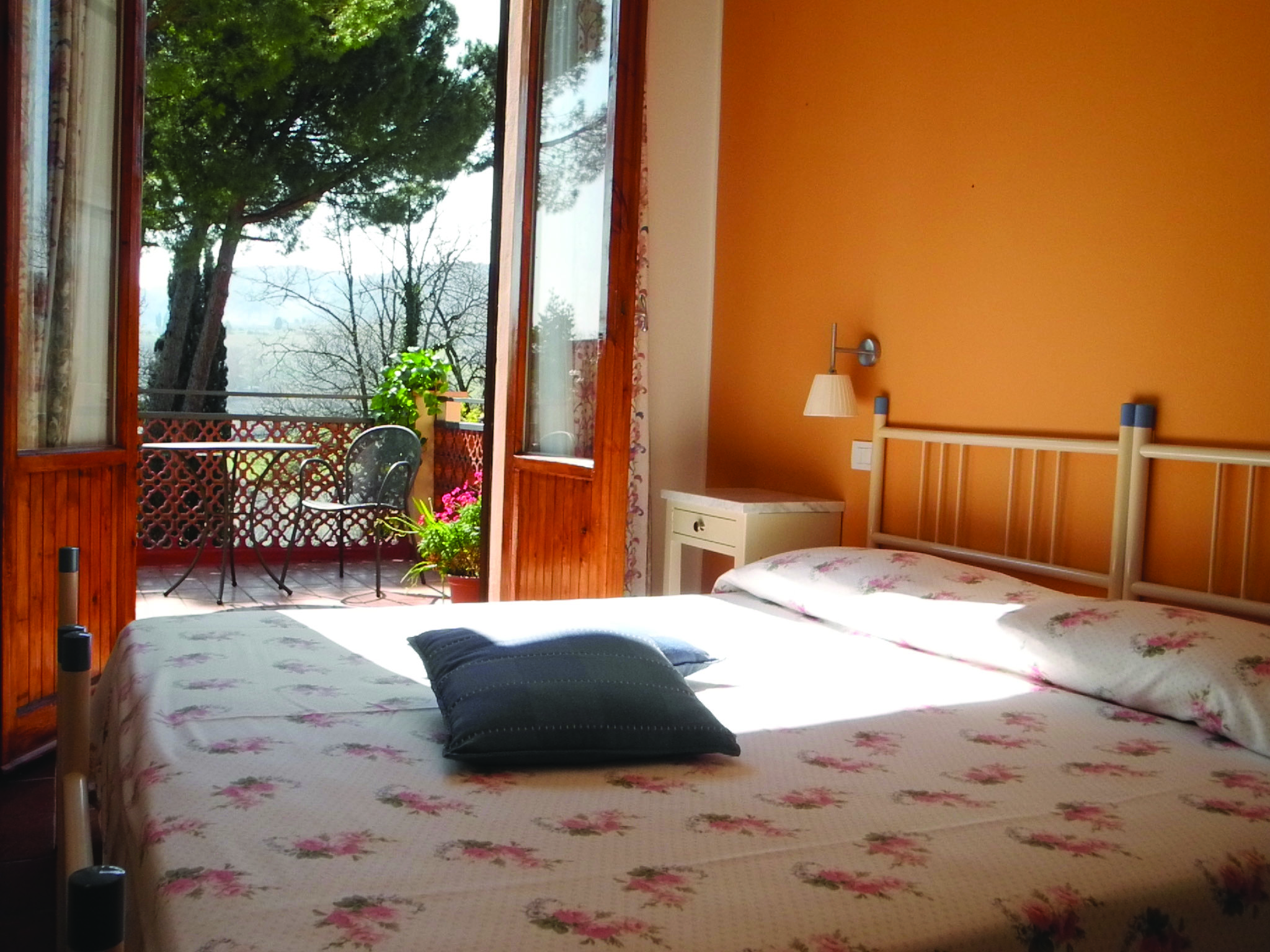 Hotel La Renaie Tuscany superior room traditional décor doors leading to balcony