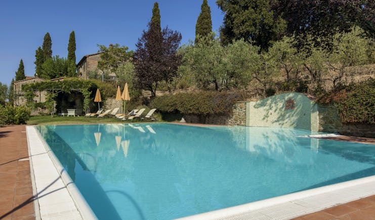 Il Faconiere Tuscany pool sun loungers umbrellas