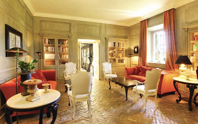 L Andana Tuscany library lounge indoor seating area chic décor