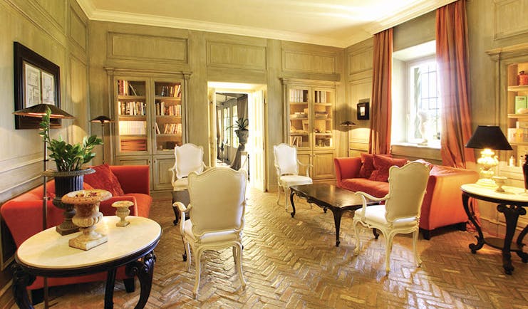 L Andana Tuscany library lounge indoor seating area chic décor