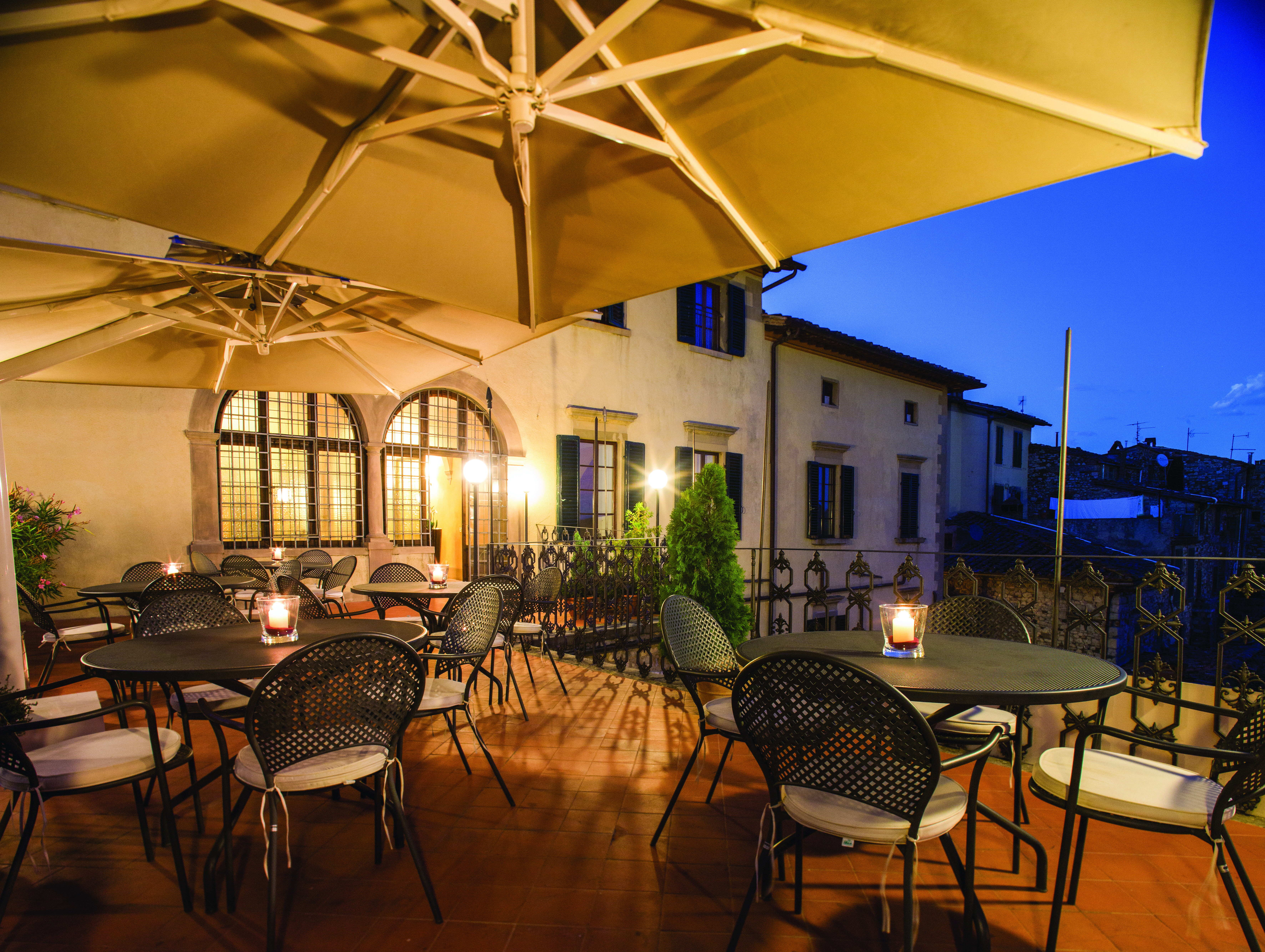 Palazzo Leopoldo Tuscany terrace outdoor seating area at night