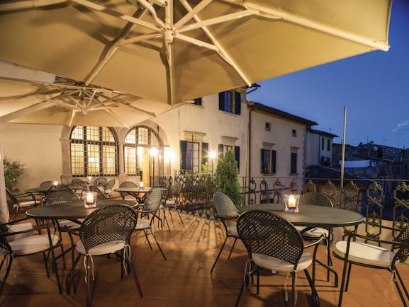 Palazzo Leopoldo Tuscany terrace outdoor seating area at night