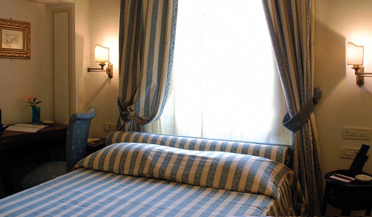 Relais dell'Orologio Pisa deluxe room bed desk window traditional décor
