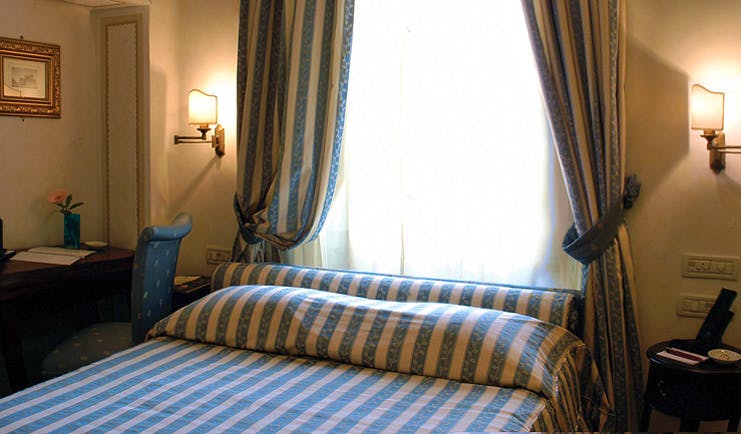 Relais dell'Orologio Pisa deluxe room bed desk window traditional décor
