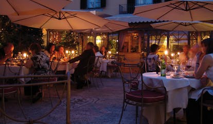 Relais dell'Orologio Pisa patio dining outdoor dining at night tables umbrellas