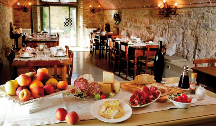 Breakfast spread with dining tables set out in the background