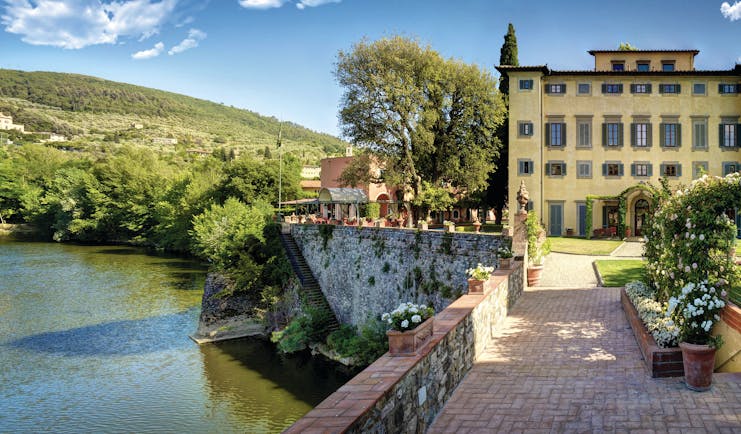 Villa La Massa Tuscany front view of hotel bridge over Arno river