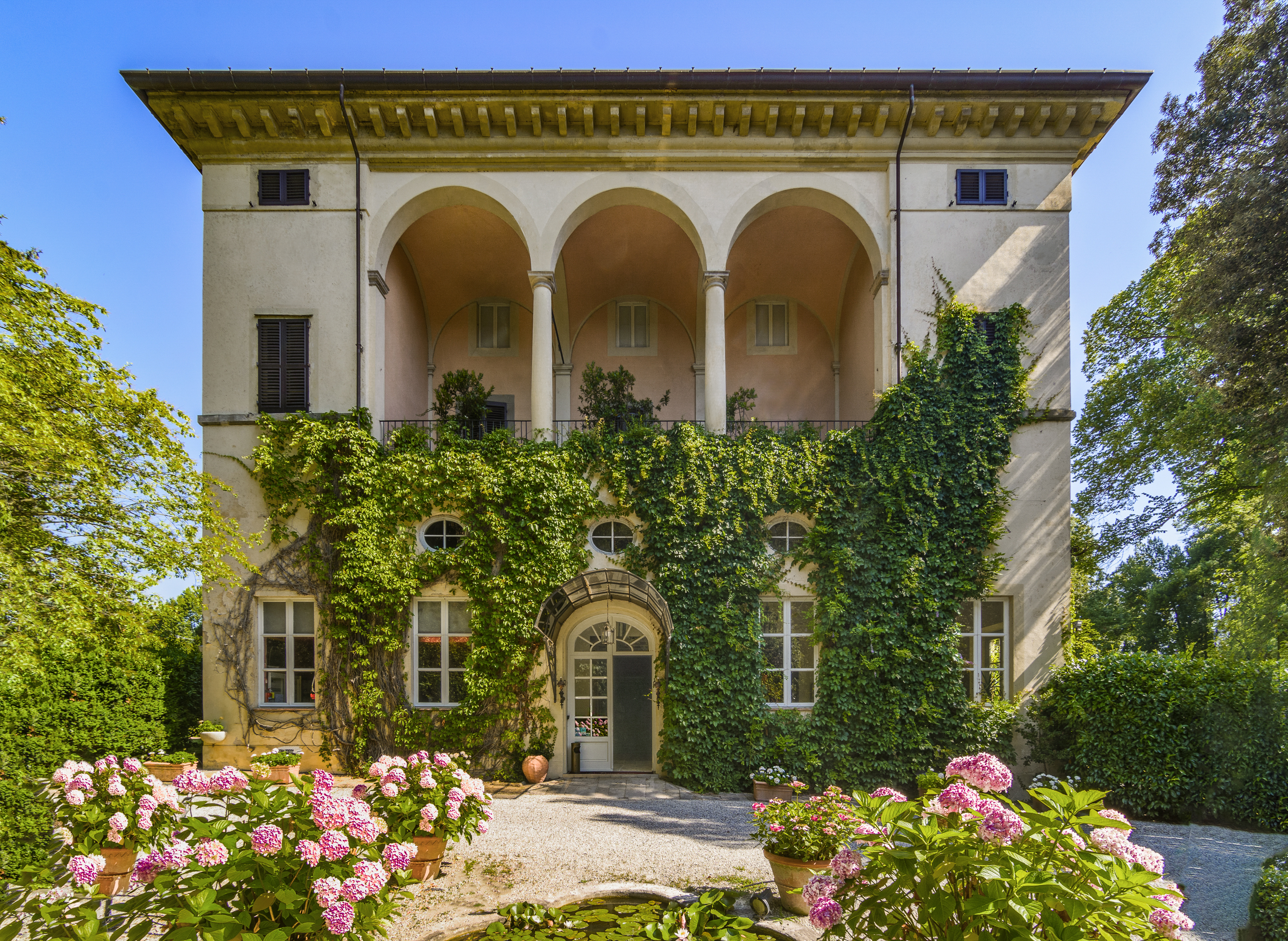 Historic arcaded villa with greenery