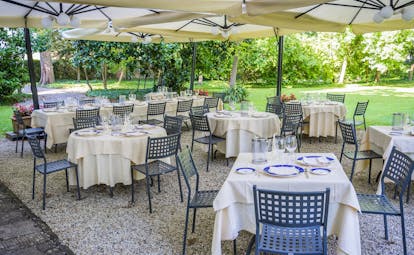 Outside tables and chairs under shade