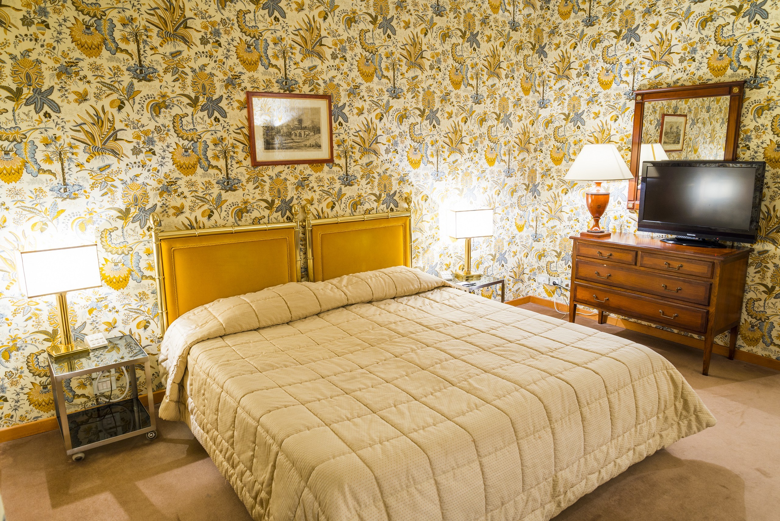 Beige bedroom with flowery walls