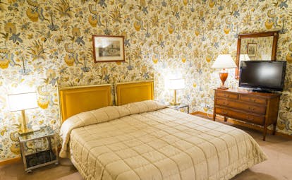 Beige bedroom with flowery walls