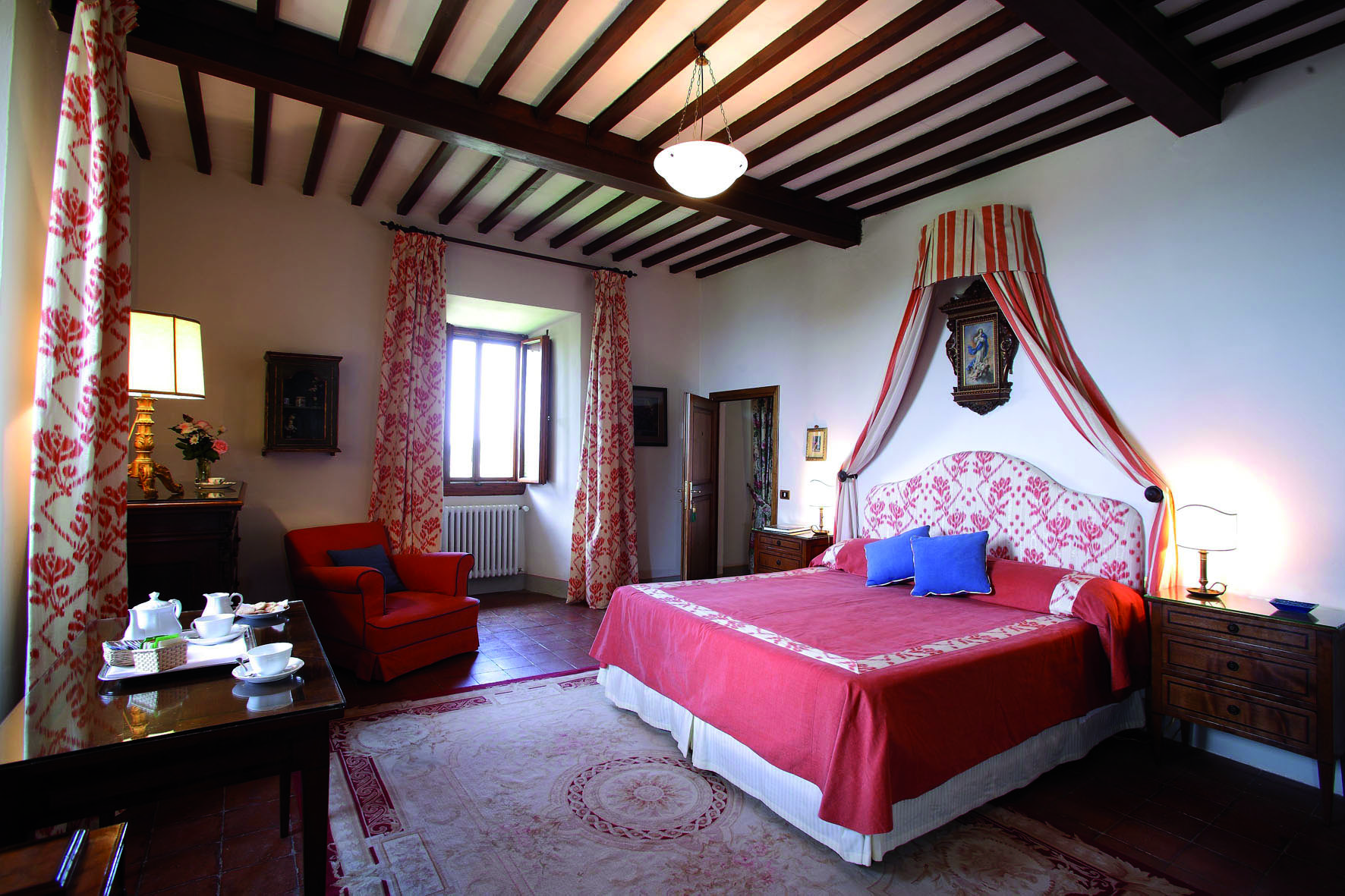 Villa Le Barone Tuscany historic suite bed armchair traditional décor