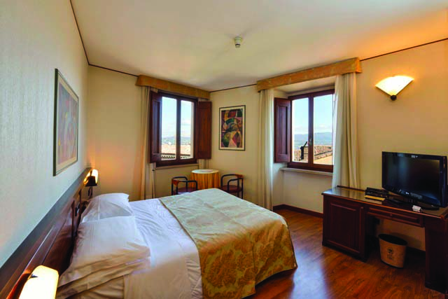 Double bed with television, table and chairs 