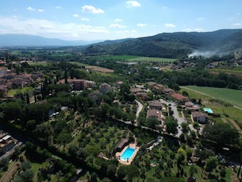 Aerial view of hotel with pool and olive groves