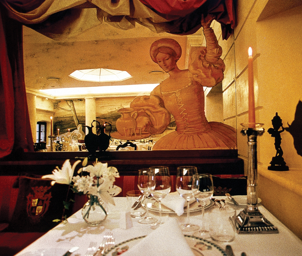 Restaurant with statue and dining table set up for dining