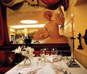 Restaurant with statue and dining table set up for dining
