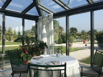 Villa Del Quar Veneto orangery indoor seating area plants glass ceiling and walls