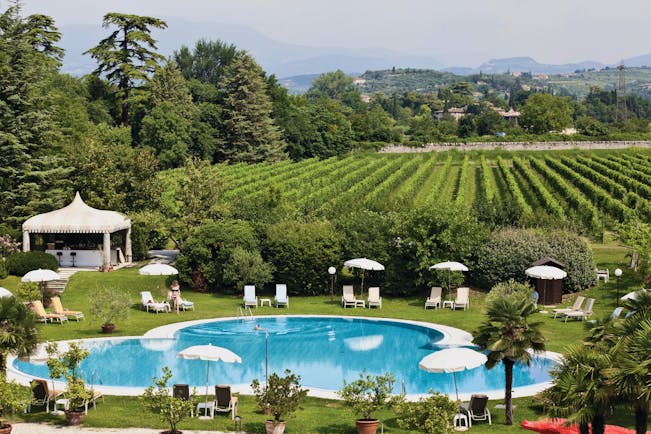 Villa Del Quar Veneto poolside lawns sun loungers view of vineyards