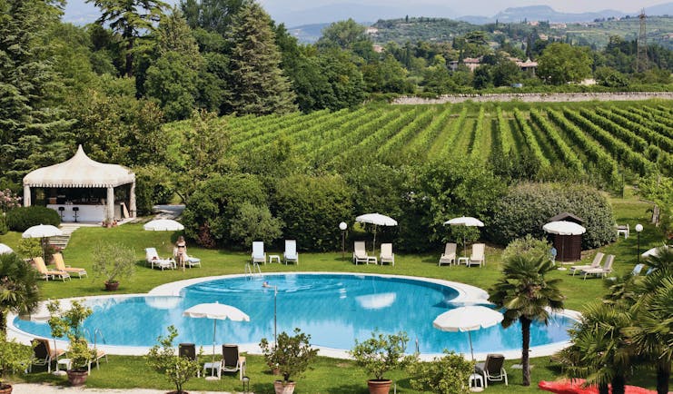 Villa Del Quar Veneto poolside lawns sun loungers view of vineyards