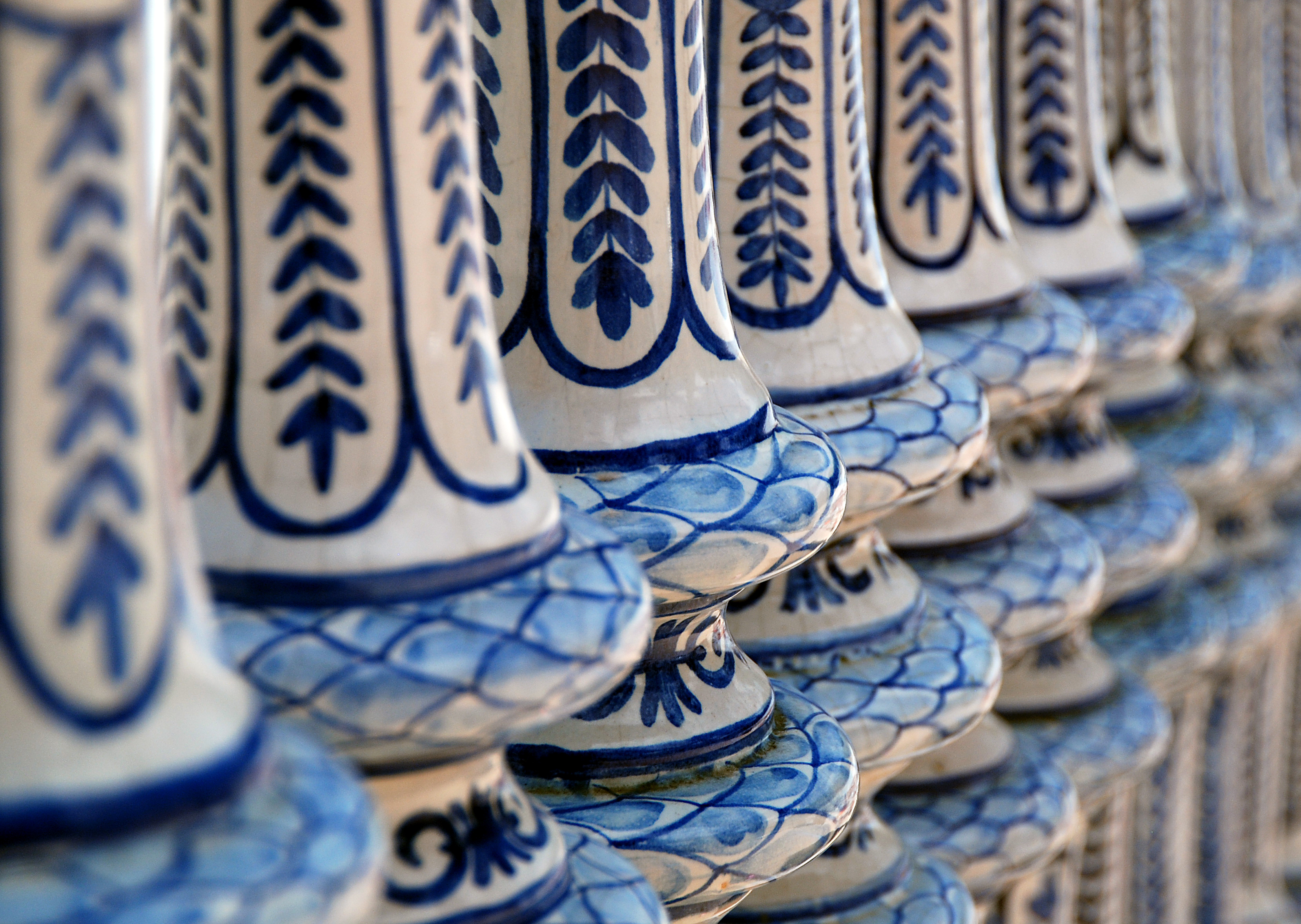 Close up shot of blue and white ceramic banisters in Plaza de Espana in Seville