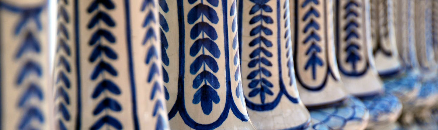Close up shot of blue and white ceramic banisters in Plaza de Espana in Seville