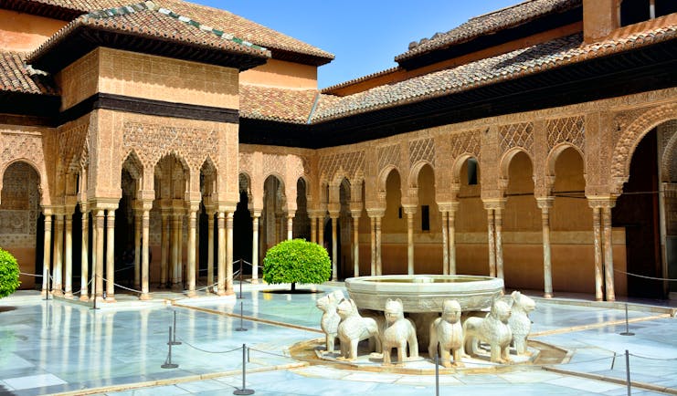 Fountain and arches of the Moorish Court of Lions at the Alhambra in Granada