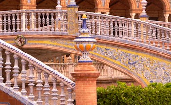 Ornate staircase with arches of building at the Plaza de Espana in Seville