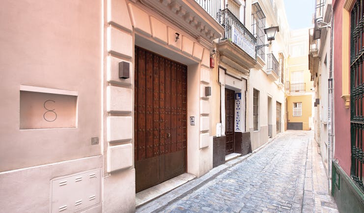Corral del Rey Seville entrance side street wooden doors