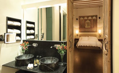 Corral del Rey Seville junior suite bed lights wooden features elegant décor