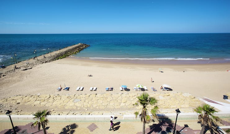 Duque de Najera Andalucia beach sandy beach sunbathers