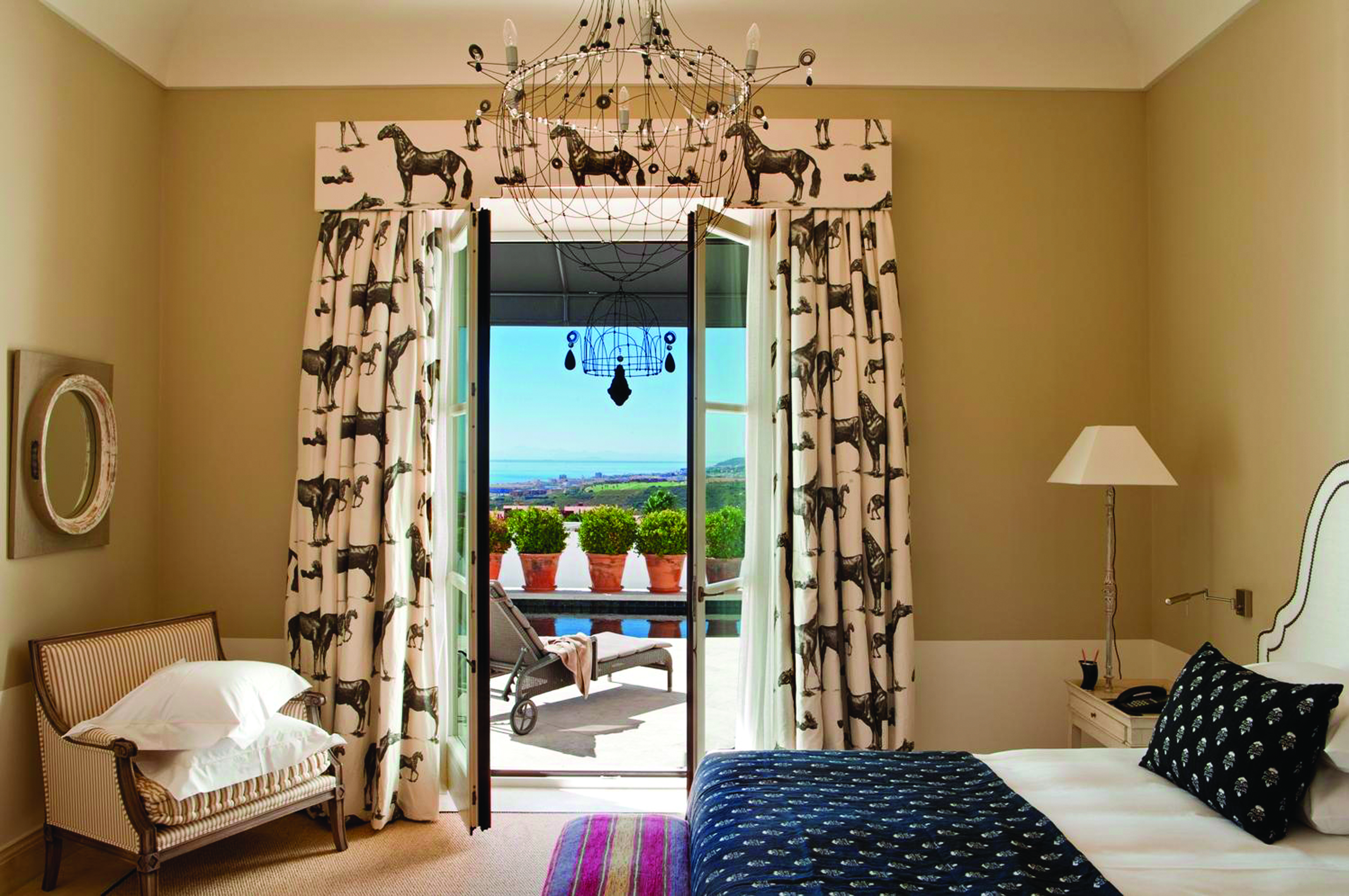 Finca Cortesin Andalucia pool suite bed chair modern décor terrace overlooking pool