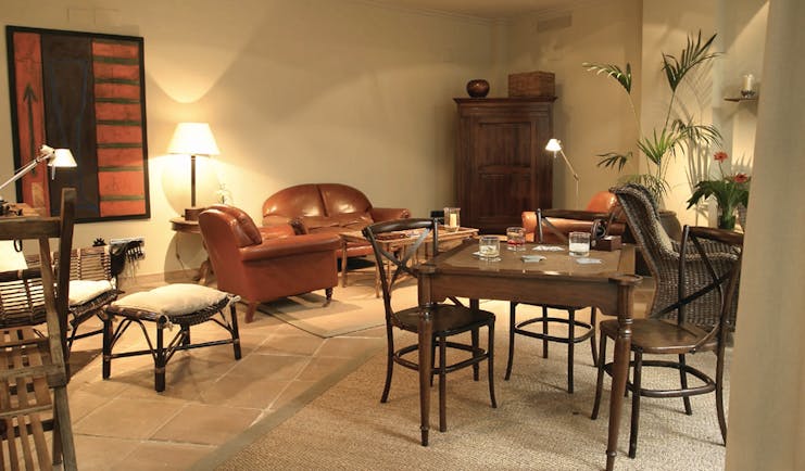 Las Casas del Rey Seville bar indoor seating area sofas chairs rustic décor