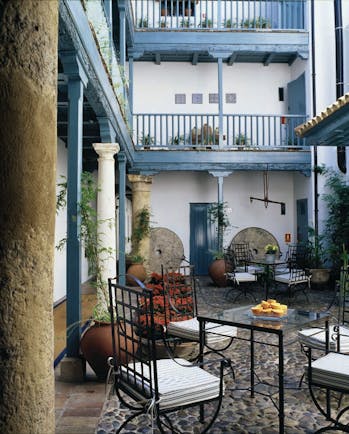 Las Casas del Rey Seville courtyard outdoor seating area tables chairs