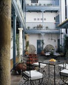 Las Casas del Rey Seville courtyard outdoor seating area tables chairs